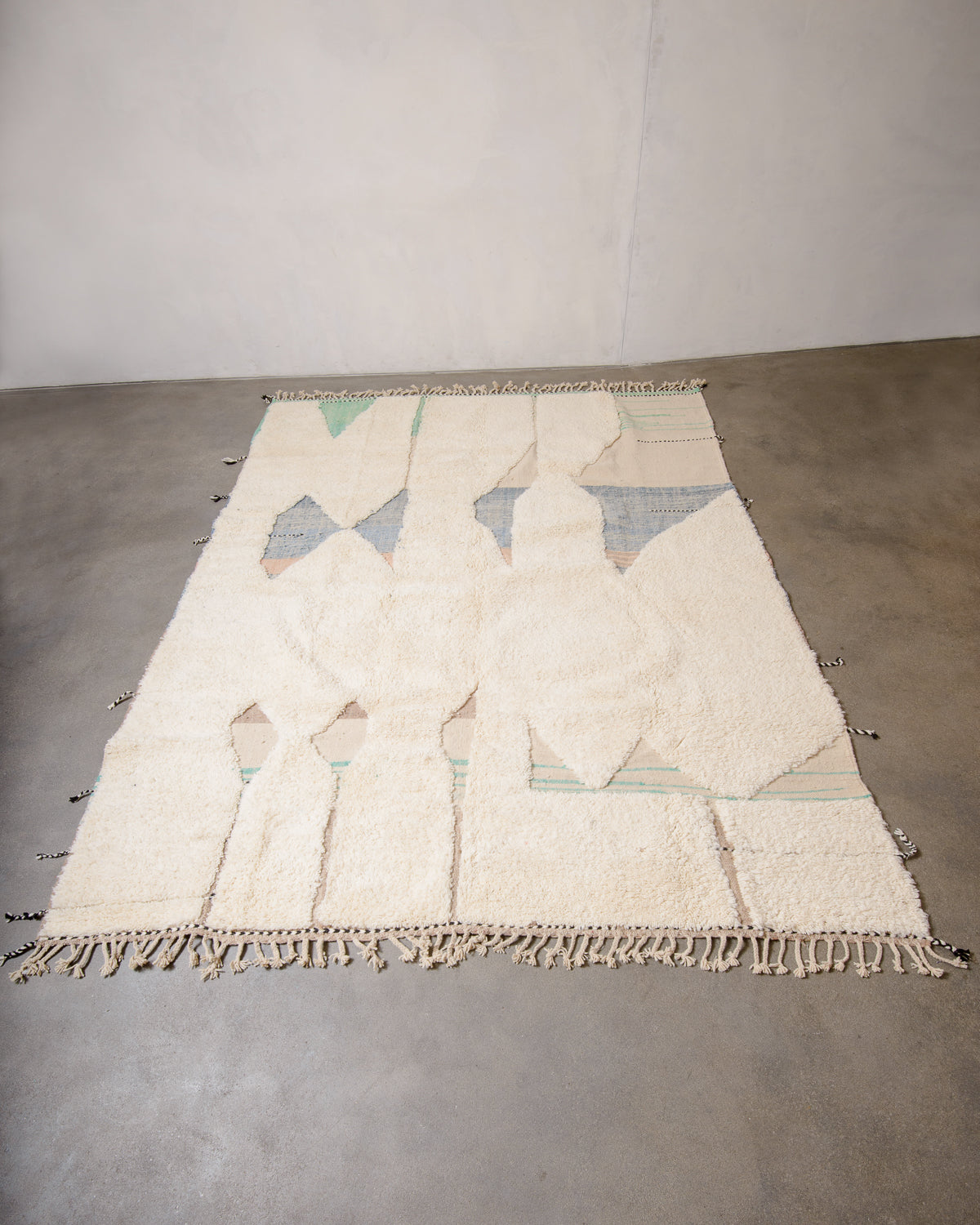 Modern, designer, handcrafted Berber rug from Morocco. Beniourain carpet with beautiful colours and patterns and fluffy wool texture.